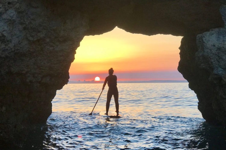 Explore the grottos of the Algarve on a sunset SUP hire from AltaVista