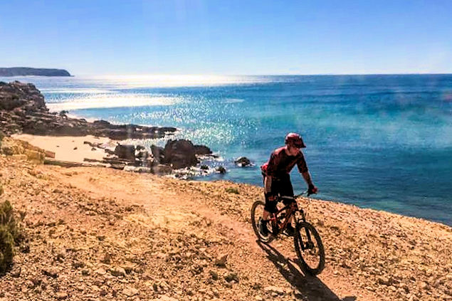 The Ocean Villas Mountain Bike instructor cycling along the Algarve coast