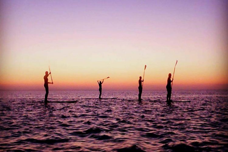 Ocean Villas friends on a paddleboarding sunset tour