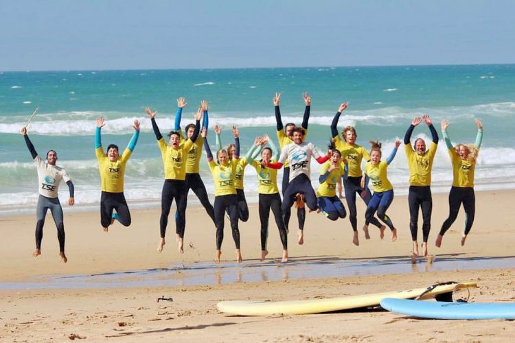 Algarve Luz Bay surfers jumping for joy