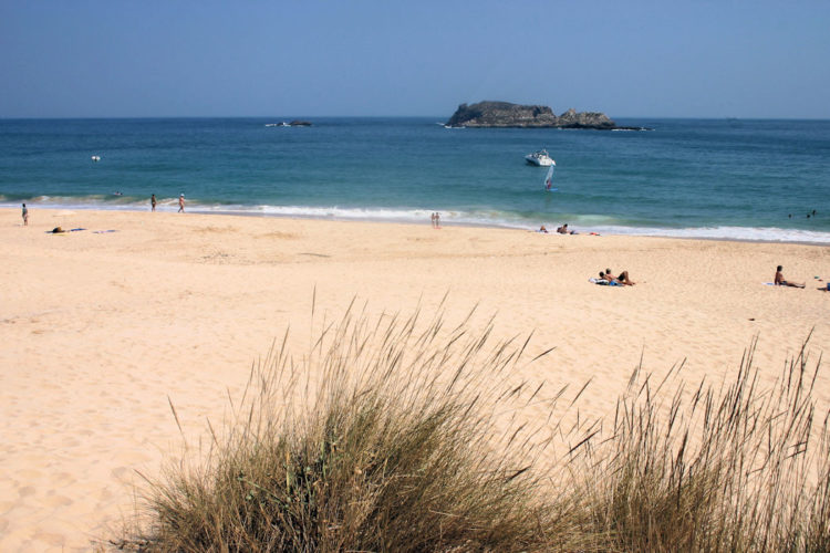 A peaceful scene at Praia do Martinhal beach with cobalt blue seas and soft golden sands is ideal for families