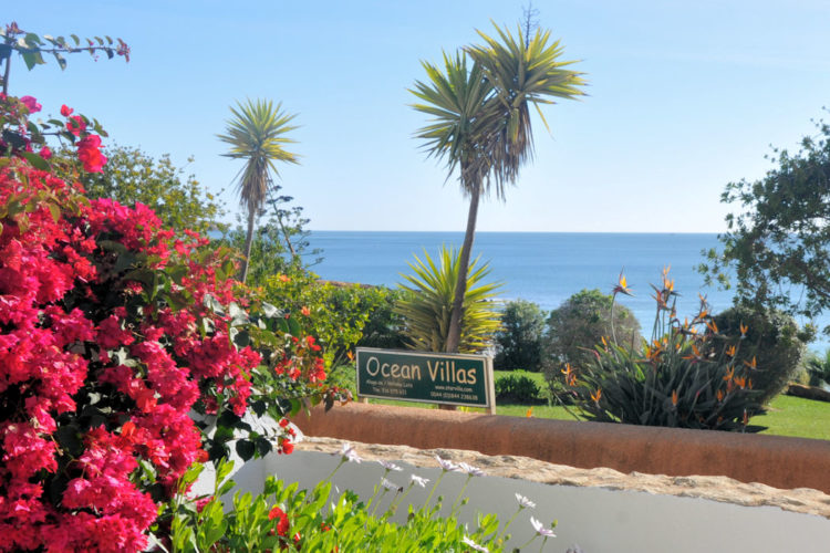 The view towards the sea and verdant gardens from the terrace of the two bedroom villa